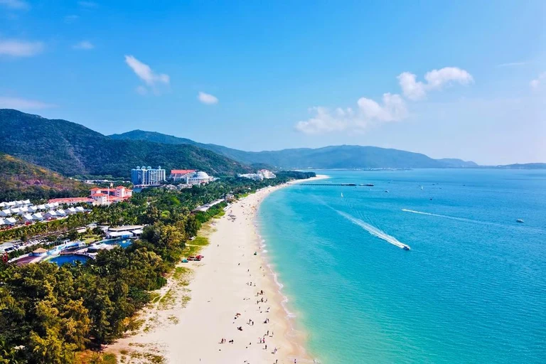Yalong Bay beach, turquoise water and resorts viewed from above