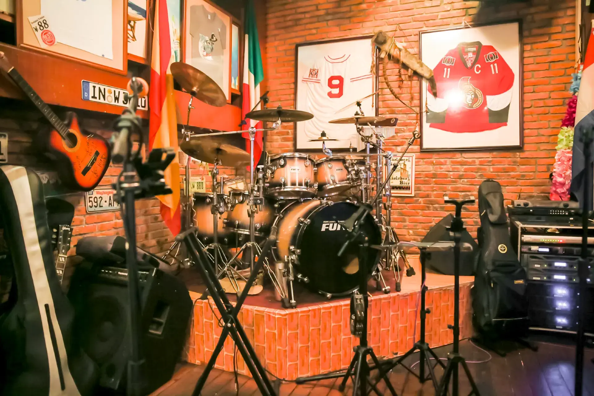 Drum kit and stage inside Dolphin Bar